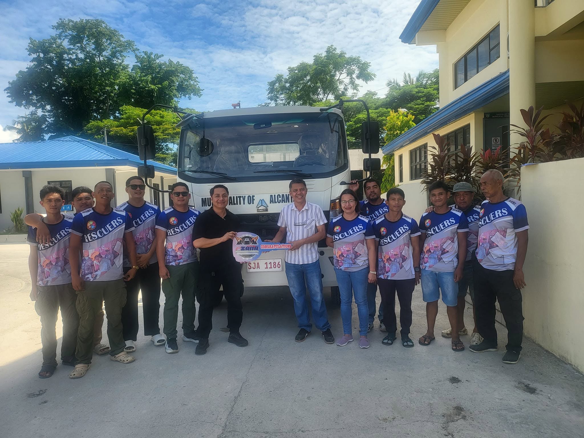 Zana Auto & Heavy Equipments Trading Inc. ceremonial key turnover with LGU officials.